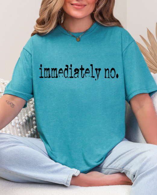 Sassy 'Immediately No' Graphic Tee hanging in a wardrobe, showcasing its stylish yet humorous design ideal for fashion enthusiasts.