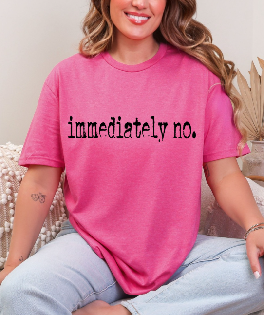 Flat position of the Sassy 'Immediately No' Graphic Tee with a playful backdrop, perfect for social media promotion of the graphic t-shirt.