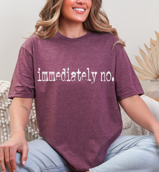 Casual setting featuring the Sassy 'Immediately No' Graphic Tee on a mannequin, emphasizing its versatility for any occasion.