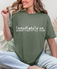 Flat lay of the Sassy 'Immediately No' Graphic Tee styled with accessories, perfect for layering or wearing solo.