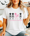 In October We Wear Pink Skeletons Unisex Softstyle T-Shirt – Breast Cancer Awareness Halloween Tee