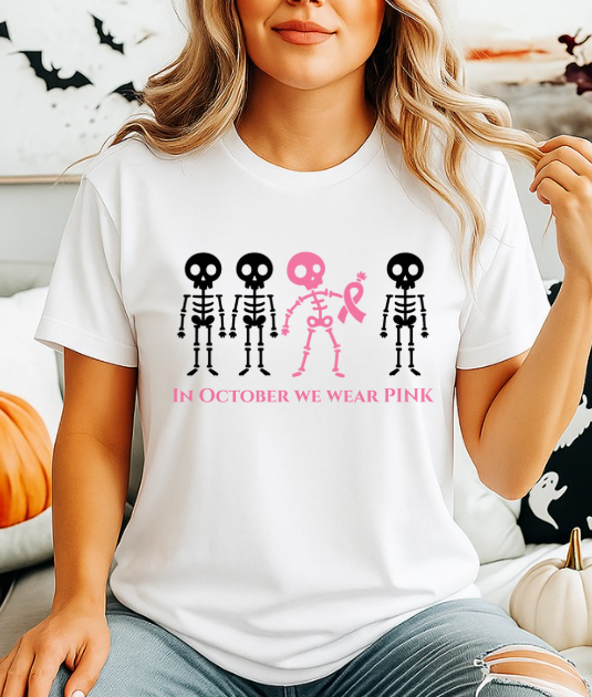 In October We Wear Pink Skeletons Unisex Softstyle T-Shirt – Breast Cancer Awareness Halloween Tee