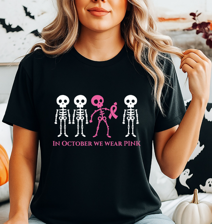 In October We Wear Pink Skeletons Unisex Softstyle T-Shirt – Breast Cancer Awareness Halloween Tee