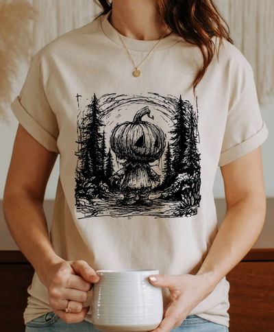 Pumpkin Head Forest Scene Unisex Softstyle T-Shirt – Spooky Halloween Graphic Tee