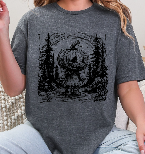 Pumpkin Head Forest Scene Unisex Softstyle T-Shirt – Spooky Halloween Graphic Tee