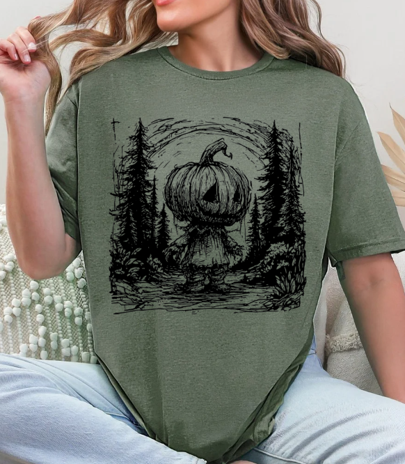 Pumpkin Head Forest Scene Unisex Softstyle T-Shirt – Spooky Halloween Graphic Tee
