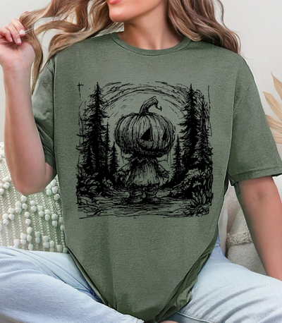Pumpkin Head Forest Scene Unisex Softstyle T-Shirt – Spooky Halloween Graphic Tee