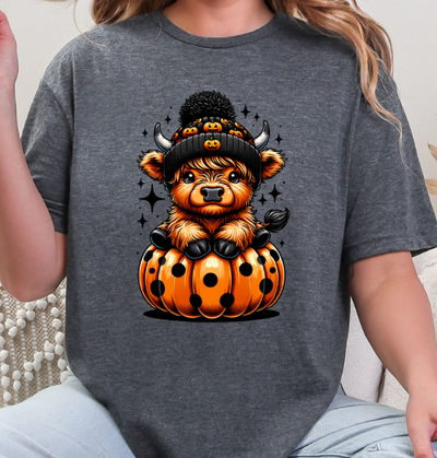 Highland Cow in Pumpkin Halloween Unisex Softstyle T-Shirt – Cute Fall Graphic Tee